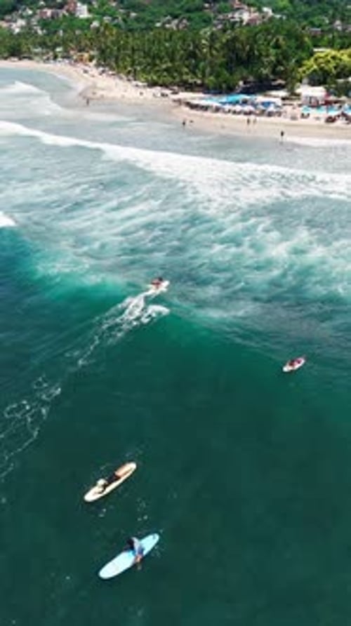 People Surfing at Mexican Beach, Sayulita, Nayarit, Mexico