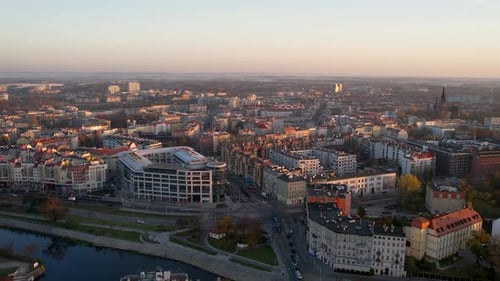 Aerial Dolly Push View Of Sunlit Rooftops Of Wroclaw Cityscape