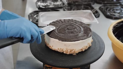 Chef Spreading Chocolate On Cream Cake Bakery and Confectionery Production