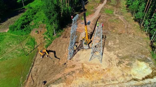 Power Line Tower Construction with Crane and Excavator