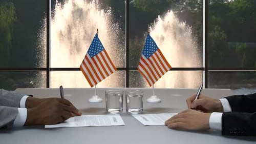 Business People Signing Contracts and Shaking Hands