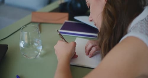 Woman Writing Notebook Online Learning