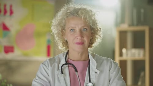 Friendly Female Doctor Smiles in Office