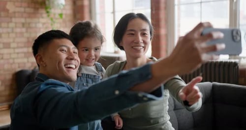 Happy Family Taking Birthday Selfie With Balloon
