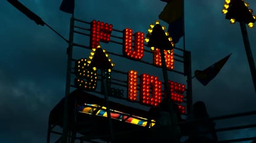 Carnival Slide at Amusement Park During Night