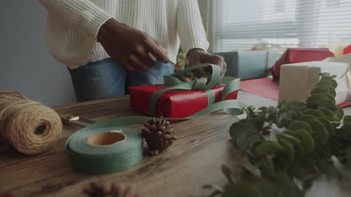 Tying Ribbon on Christmas Gift Package