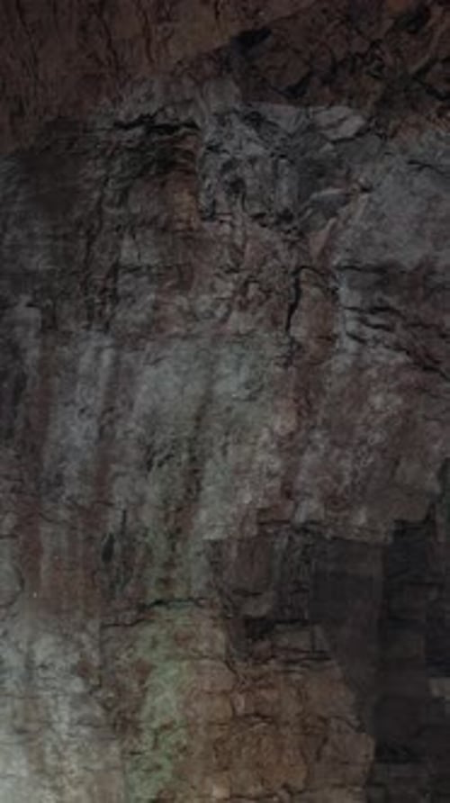 A Cave with Sunlight Coming Through the Rocks
