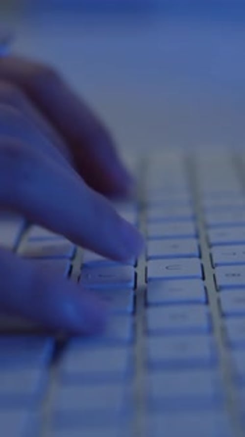 Unrecognizable Person Coding, Using Keyboard on Laptop