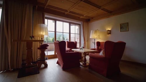 Inviting Seating Area with Red Armchairs and Natural Light