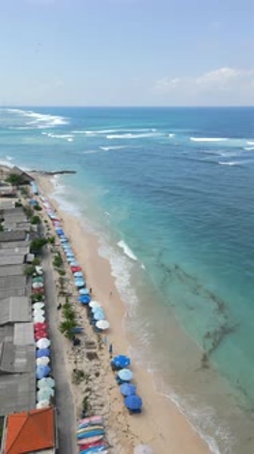Aerial View of Beach with White Sand and Turquoise Water in Bali Indonesia