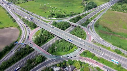 Aerial huge multi-lane circle roundabout intersection in city traffic highway. Public transport