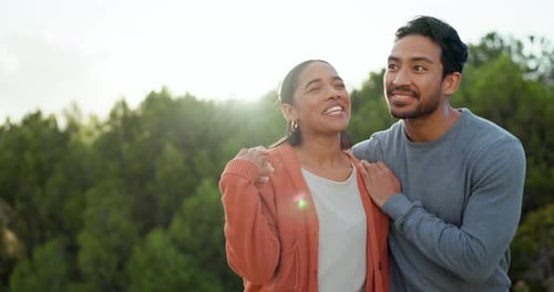 Couple, talking and walking at a park outdoor with love, happiness and care in summer