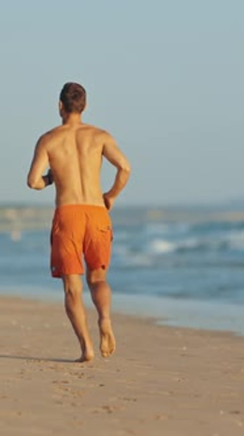 Lifeguard Running on the Beach