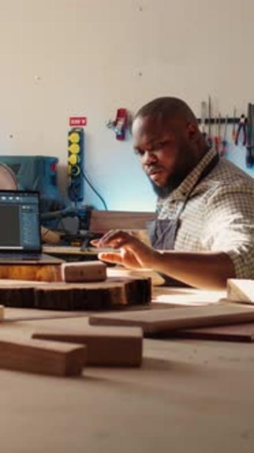Vertical Video Happy Cabinetmaker and Colleague Comparing Wood Piece with Schematic