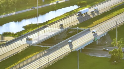 Aerial View of Highway Overpass with Moving Traffic Cars and Trucks