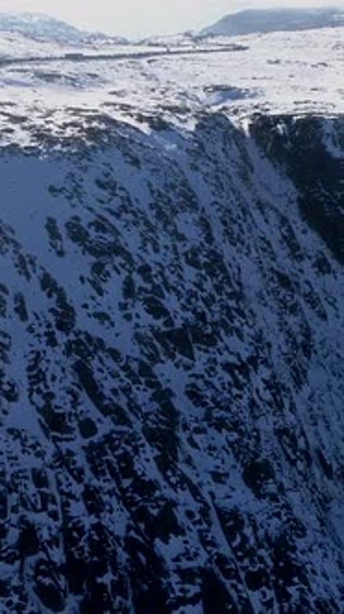 Flying Over Mountain Covered by Snow. Serra da Estrela Portugal vertical video