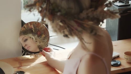 Blonde Woman Adorns Jewelry in Natural Light
