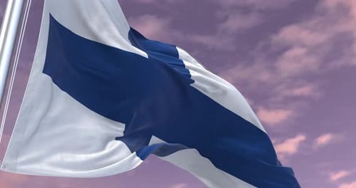 Realistic Finland Flag Waving Against a Dramatic Sky