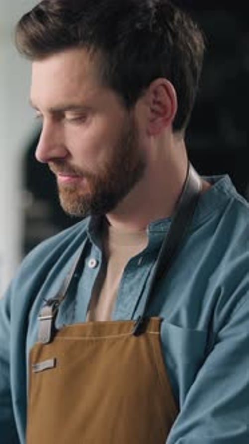Caucasian Man Working in Factory Roasting Coffee Beans Roaster Machine Industrial Production Aroma