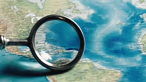Magnifying Glass Exploring Colorful Detailed World Map