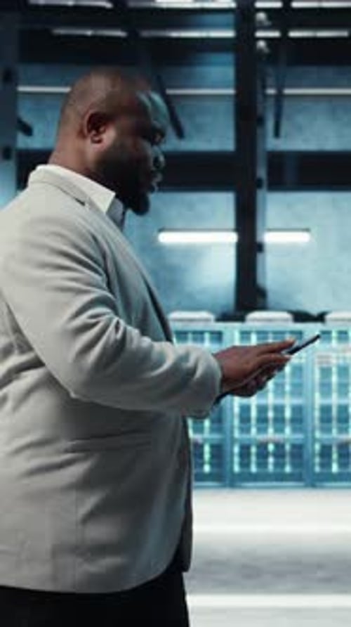 Vertical Video Data Center Engineer Adjusting Blade Server Hardware