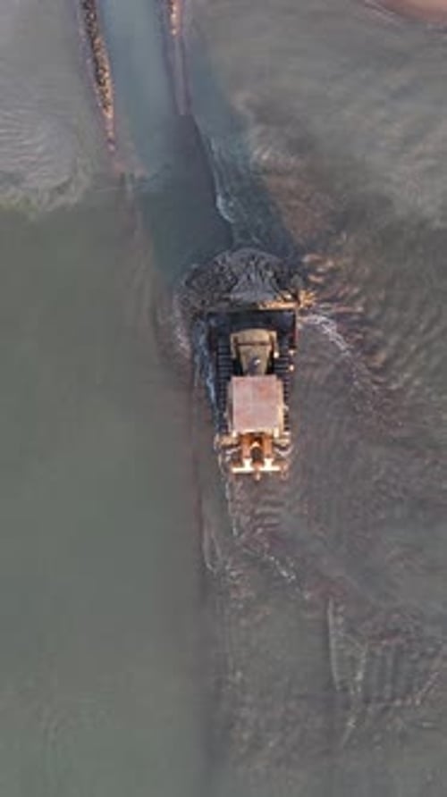 Bulldozer Working The Beach