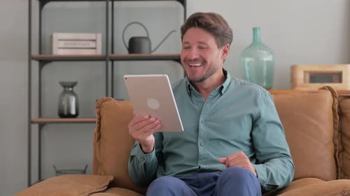 Man Having a Video Call on Tablet Device