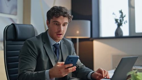 Surprised Boss Looking Smartphone Office Closeup Excited Man Rejoicing Success