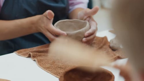 Person Works with the Clay in the Pottery Workshop During Masterclass