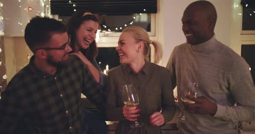 Friends Laughing and Talking at Indoor Get-Together