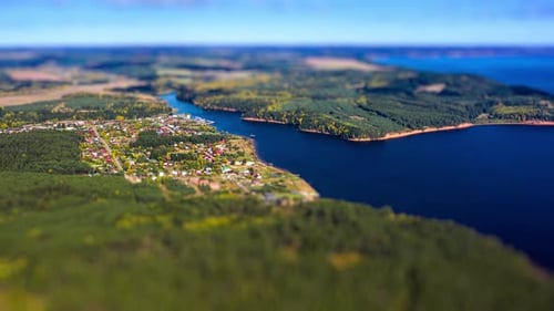 Aerial timelapse of the river of Kama. Hyperlapse of Kama river during sunny autumn day. Tilt shift
