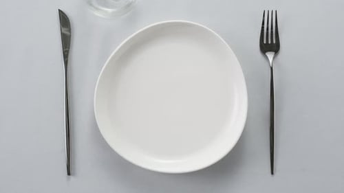 Empty Dinner Plate with Fork and Knife