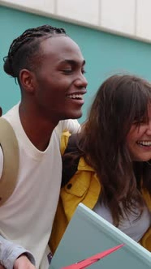 Happy Diverse Group of Student Friends Laughing Together at College Campus