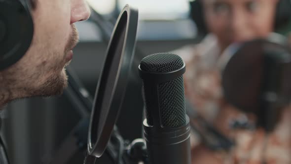 Speaking into Microphone During Recording in Studio, People Stock ...