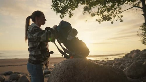 Woman Tourist Walks on Sandy Sea Beach Female Traveler Carrying Big Backpack with Touristic