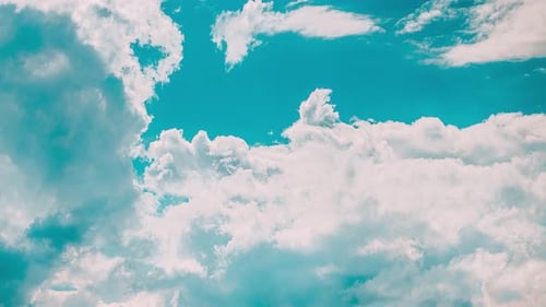 Clouds Time-Lapse Floating in a Vivid Blue Sky