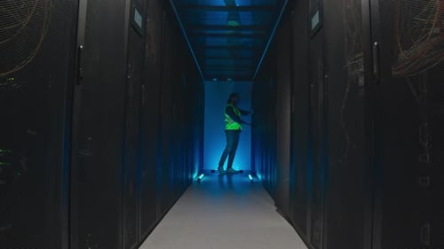 IT Engineer Checking Work of Rack Server Cabinets in Data Center