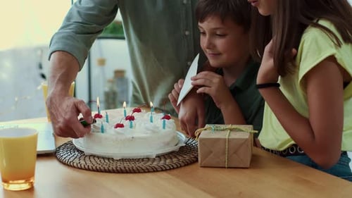 Happy Boy Celebrates Birthday with Family at Home