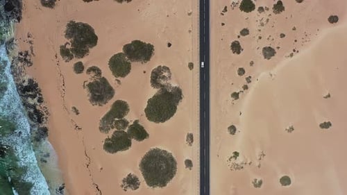 Aerial Road Crossing Desert Landscape and Beaches