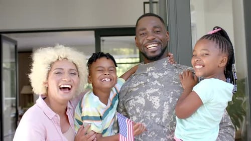 Happy Family United Outside their Suburban Home