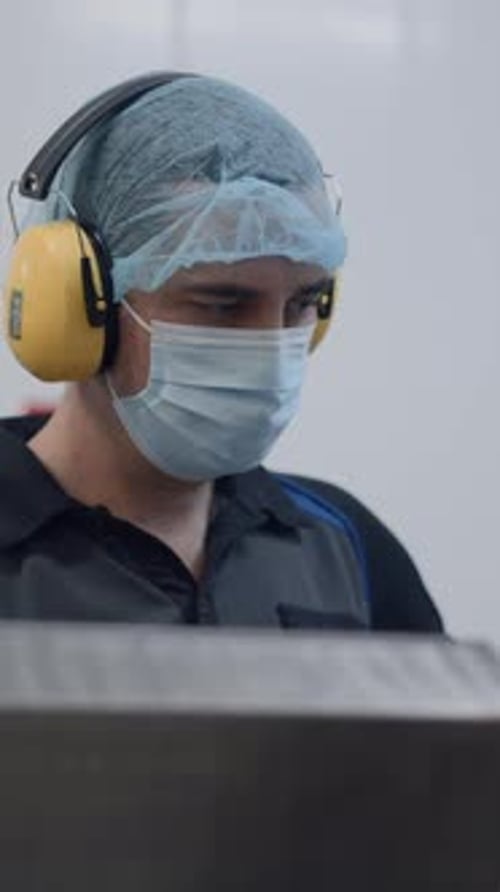 Busy Male Employee Controls Equipment At Beer Factory Medium Shot