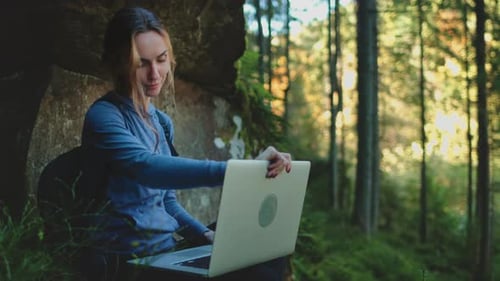 Female Trekking with Laptop Relax in Green Forest