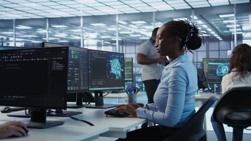 Tech Team Collaborates in Modern Office Workplace