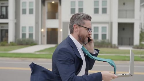 Stressed and Anxious Young Man in a Hurry Running Man in a Hurry and Run Working on Laptop Using