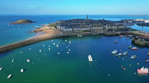Smooth forward drone movement towards the Intra Muros fortified coastline, Saint-Malo, France.