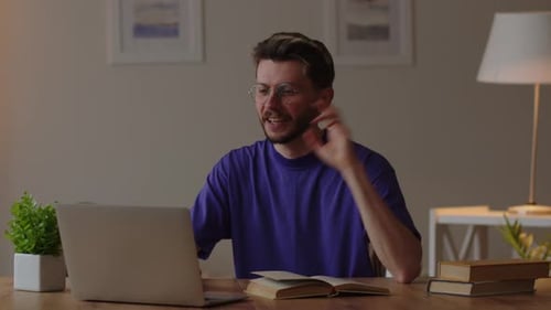 Young Adult Engaging in Lively Video Conference