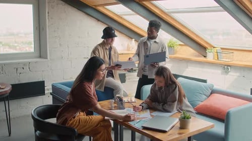 Diverse Startup Colleagues Working in Loft Office