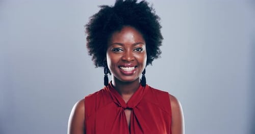 Smiling Woman Making a Heart Gesture with Hands
