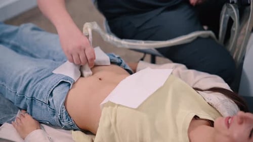 Woman Getting Abdominal Ultrasound in Doctor's Office