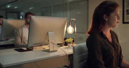 Night in office, business people in coworking space and computer for research, email or networking